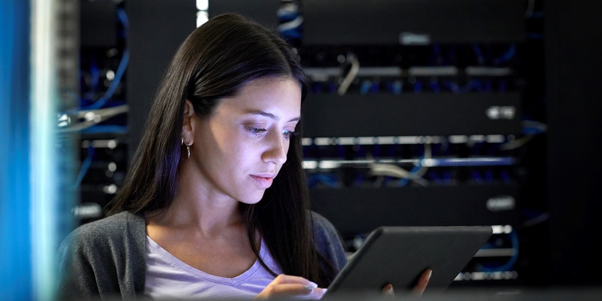 woman looking at tablet 